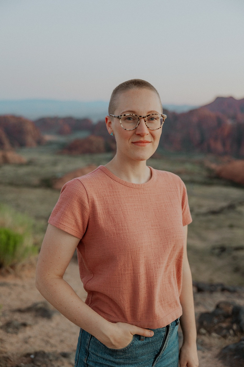 Brittany Feitz standing in the red rock desert near Sierra Vista, Arizona