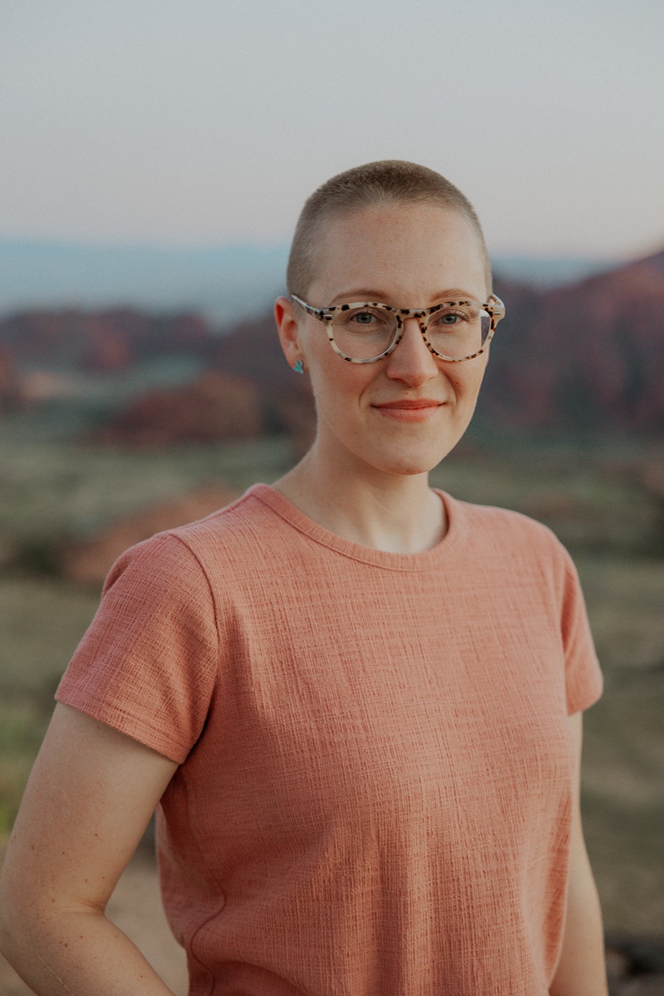 Brittany Feitz, owner of Money Feitz Bookkeeping, smiling outdoors in the Sierra Vista desert